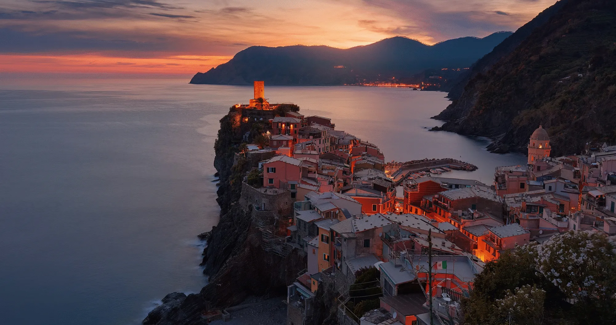 Vernazza at sunset on the Italian Riviera, a luxury group travel destination for adults exploring Cinque Terre together.